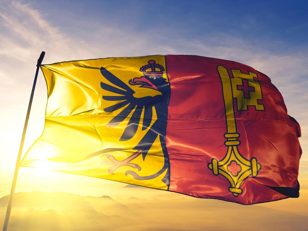 Genfer Flagge im Gegenlicht – Teambuilding mit Outdoor Escape Games in Genf